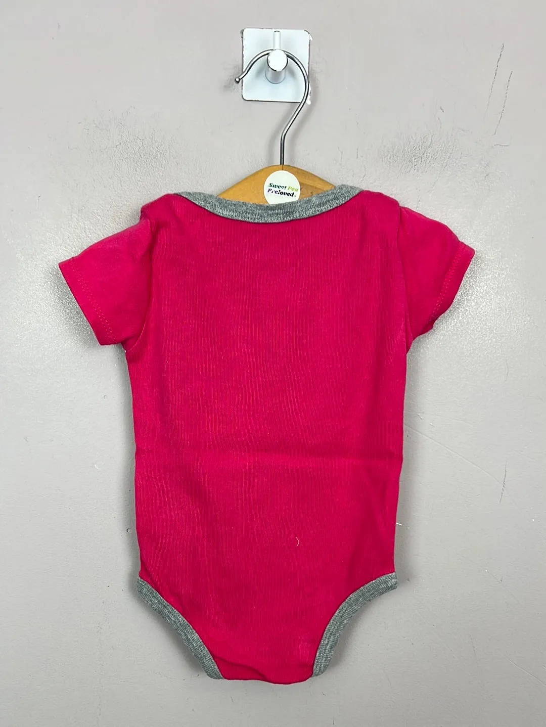 Nike pink bodysuit & hat 0-6m